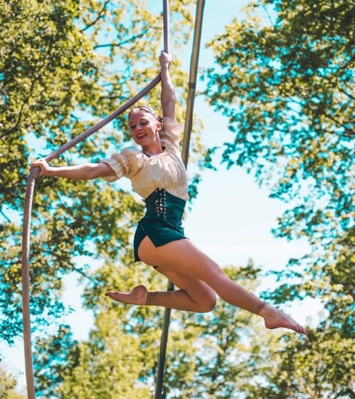 a woman performs aerial stunts after a ninja fit class near me in londonderry